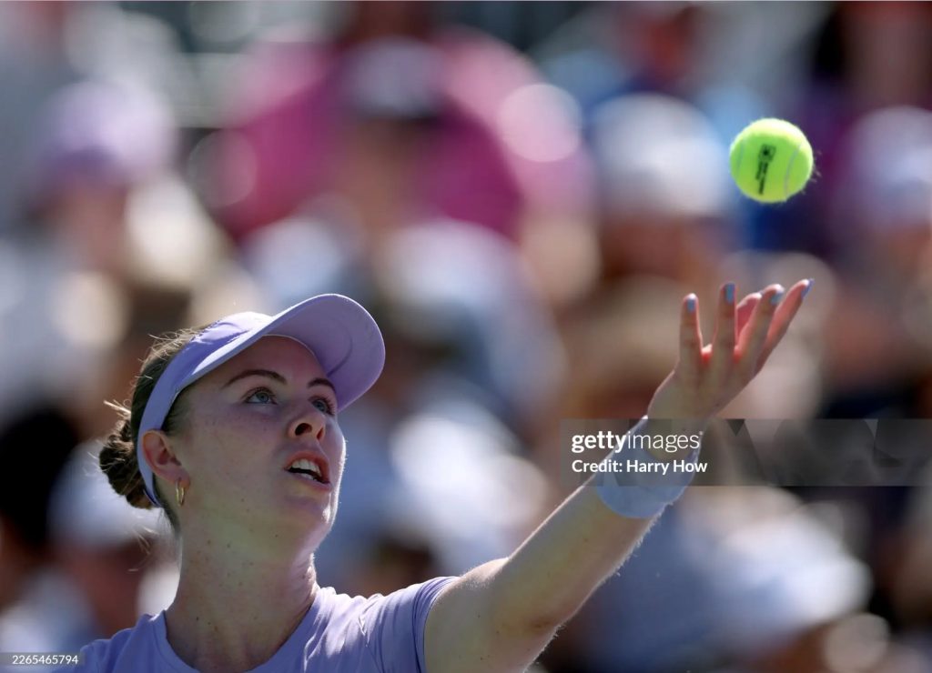 Photo of Talia Gibson as she serves in a round 3 match at Indian Wells