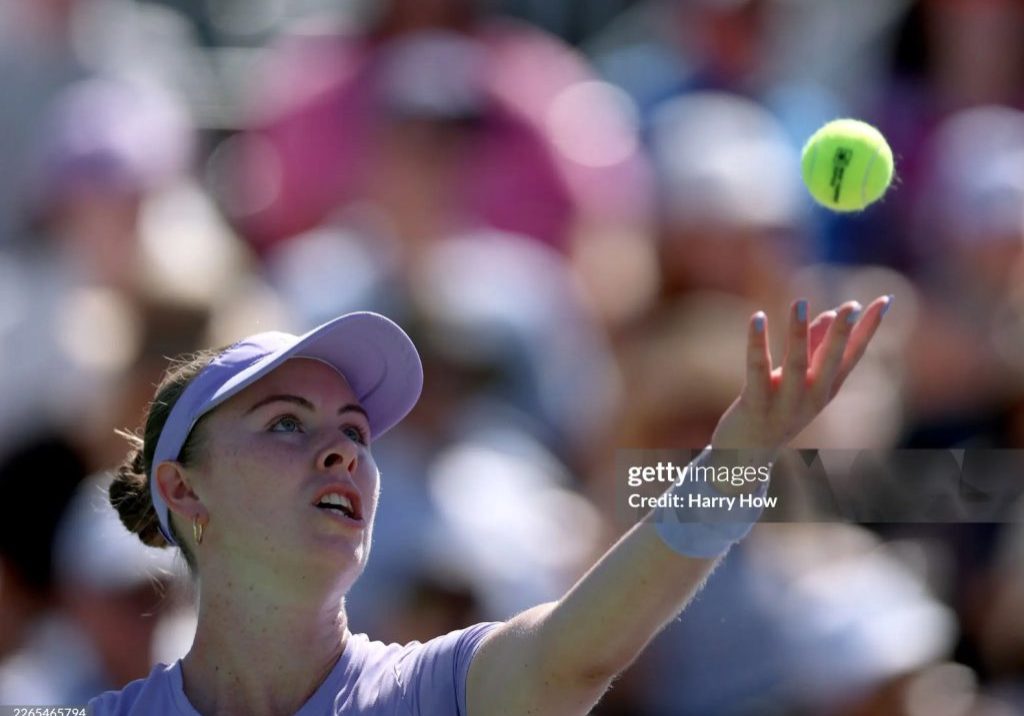 Photo of Talia Gibson as she serves in a round 3 match at Indian Wells